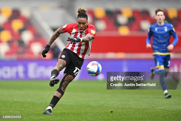 Ivan Toney of Brentford takes a shot during the Sky Bet Championship match between Brentford and Nottingham Forest at Brentford Community Stadium on...