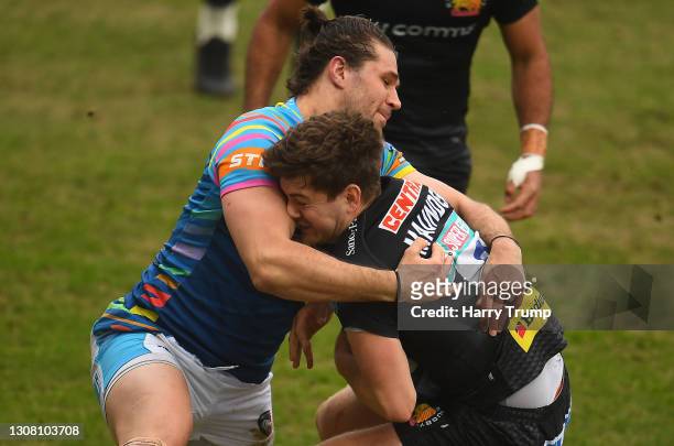 Jack Maunder of Exeter Chiefs is tackled by Kobus Van Wyk of Leicester Tigers, resulting in a red card for Kobus Van Wyk during the Gallagher...