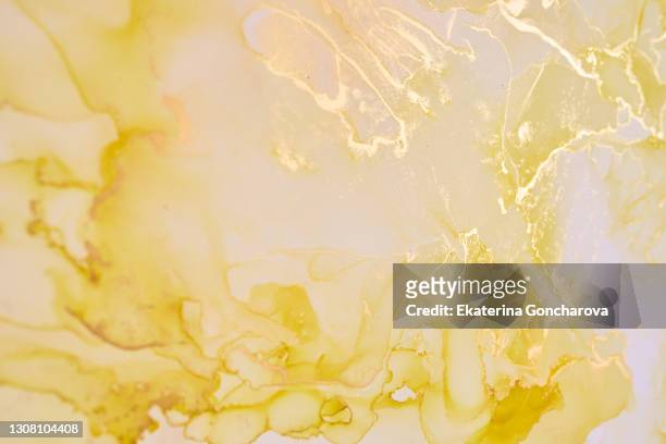 natural yellow luxury abstract fluid art painting in alcohol ink technique. - metallic ink stock pictures, royalty-free photos & images