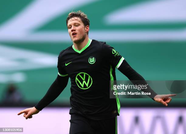 Wout Weghorst of VfL Wolfsburg celebrates after scoring their team's second goal during the Bundesliga match between SV Werder Bremen and VfL...
