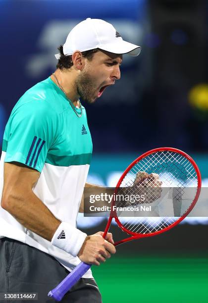 Aslan Karatsev of Russia celebrates beating Lloyd Harris of South Africa to win the men's singles Final match on day fourteen of the Dubai Duty Free...