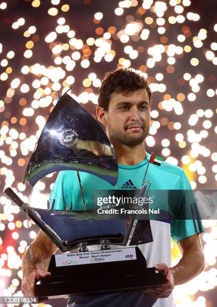 Aslan Karatsev of Russia poses with the trophy after beating Lloyd Harris of South Africa to win the men's singles Final match during day fourteen of...