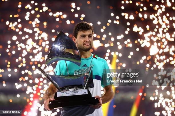 Aslan Karatsev of Russia poses with the trophy after beating Lloyd Harris of South Africa to win the men's singles Final match during day fourteen of...