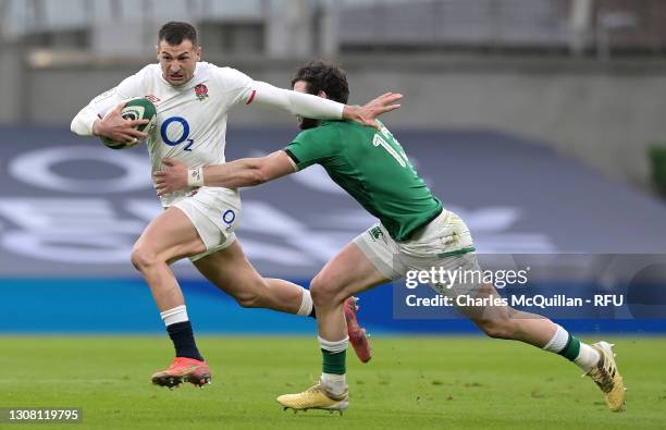 Jonny May of England attempts to hand off Robbie Henshaw of Ireland during the Guinness Six Nations match between Ireland and England at Aviva...