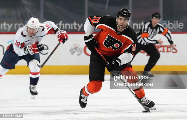 Andy Andreoff of the Philadelphia Flyers skates the puck against the Washington Capitals at the Wells Fargo Center on March 13, 2021 in Philadelphia,...