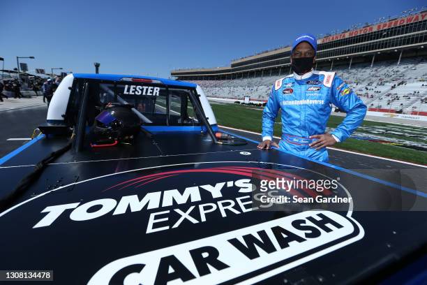 Bill Lester, driver of the Camping World Ford, poses for photos prior to the NASCAR Camping World Truck Series Fr8Auctions 200 at Atlanta Motor...