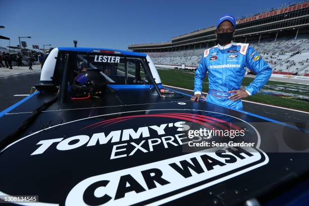 Bill Lester, driver of the Camping World Ford, poses for photos prior to the NASCAR Camping World Truck Series Fr8Auctions 200 at Atlanta Motor...