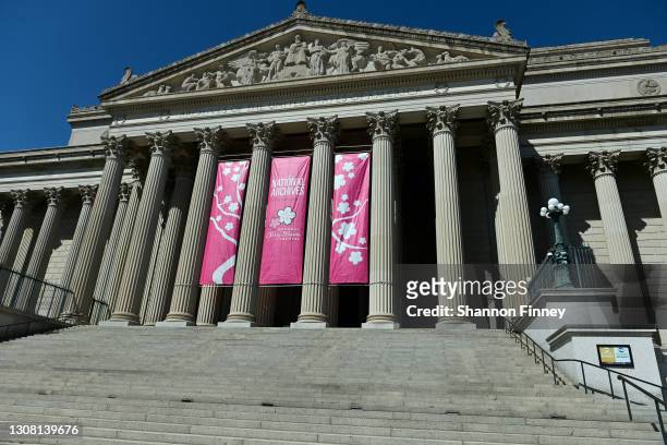 Pink banners adorn The National Archives Building on the first day of the National Cherry Blossom Festival and the first weekend of Spring on March...