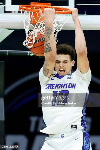 Christian Bishop of the Creighton Bluejays dunks against the UC Santa Barbara Gauchos during the second half in the first round game of the 2021 NCAA...