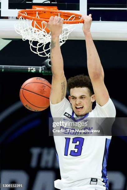 Christian Bishop of the Creighton Bluejays dunks against the UC Santa Barbara Gauchos during the second half in the first round game of the 2021 NCAA...