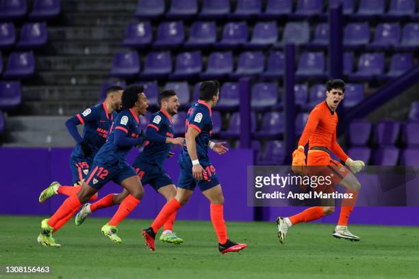 Yassine Bounou of Sevilla FC celebrates with teammates after scoring their team's first goal during the La Liga Santander match between Real...