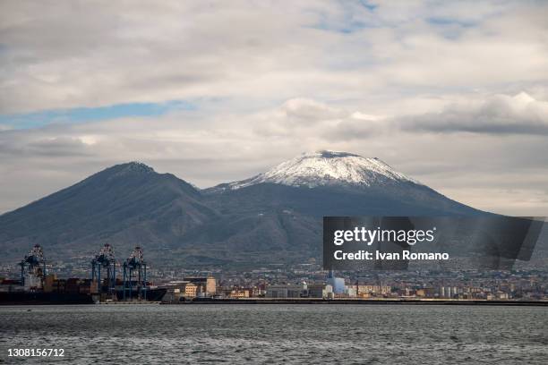 Mount Vesuvius is capped with snow as seen from the Maritime Station on March 20, 2021 in Naples, Italy.