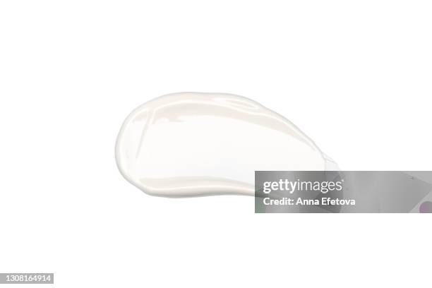 white cosmetics smear on isolated white background. perfect swatch for advertising and packaging. from above. flat lay style - zahnpasta stock-fotos und bilder