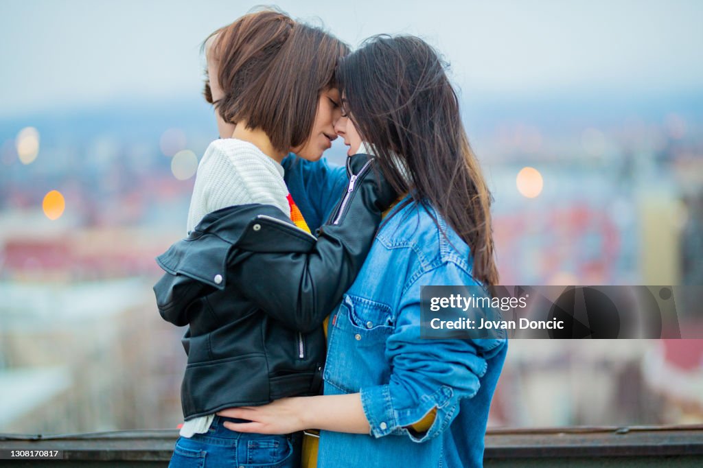Young lesbian couple kissing