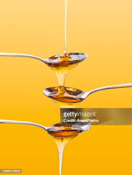 multiple cascade of honey - sirup stock-fotos und bilder