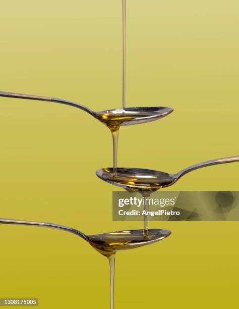 multiple cascade of olive oil - olive oil stock pictures, royalty-free photos & images