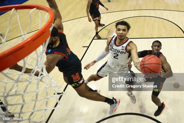 James Bouknight of the Connecticut Huskies shoots against the Maryland Terrapins during the first half in the first round game of the 2021 NCAA Men's...