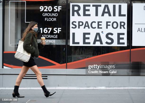 Person walks by a sign that reads, "retail space for lease" in Hell's Kitchen amid the coronavirus pandemic on March 20, 2021 in New York City. After...