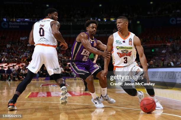 Scott Machado of the Taipans drives to the basket under pressure from Casper Ware of the Kings during the NBL match between the Sydney Kings and the...