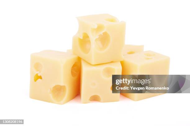 cheese cubes isolated on white background - käse stock-fotos und bilder