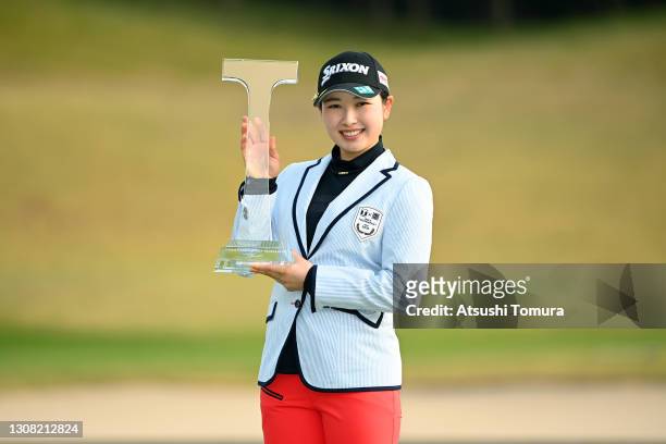 Sakura Koiwai of Japan poses with the trophy after winning the tournament following the final round of the T-point x ENEOS Golf Tournament at the...