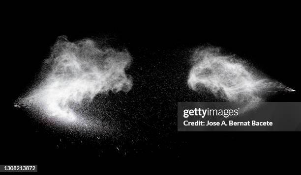 collision of two pressurized water jets on a black background. - water sprayer photos et images de collection