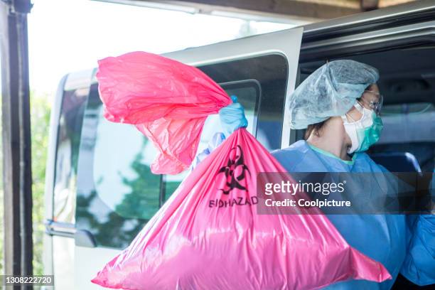 doctor with biological waste. - hospital alarm stock pictures, royalty-free photos & images