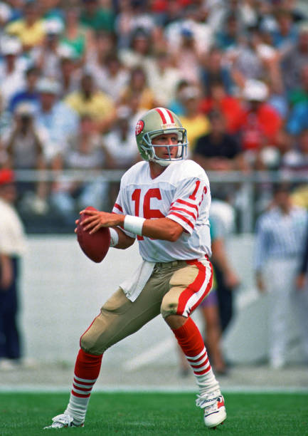 Quarterback Joe Montana of the San Francisco 49ers looks to pass during a preseason game against the Kansas City Chiefs at Fawcett Stadium at the Pro...