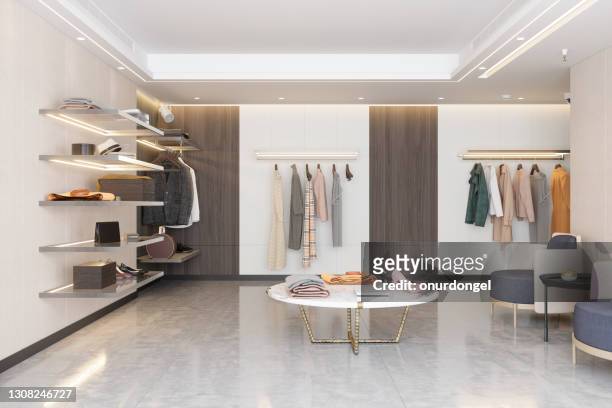 luxury clothing store with clothes, shoes and other personal accessories. - indoors stock pictures, royalty-free photos & images