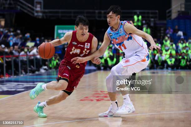 Wu Qian of south team drives the ball against Qi Lin of north team in the All-Star game during the 2021 Chinese Basketball Association Allstar...