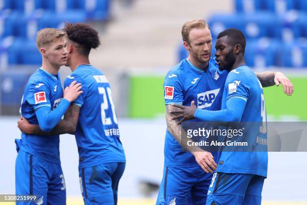 Ihlas Bebou of TSG 1899 Hoffenheim celebrates with Kevin Vogt after scoring their side's first goal during the Bundesliga match between TSG...