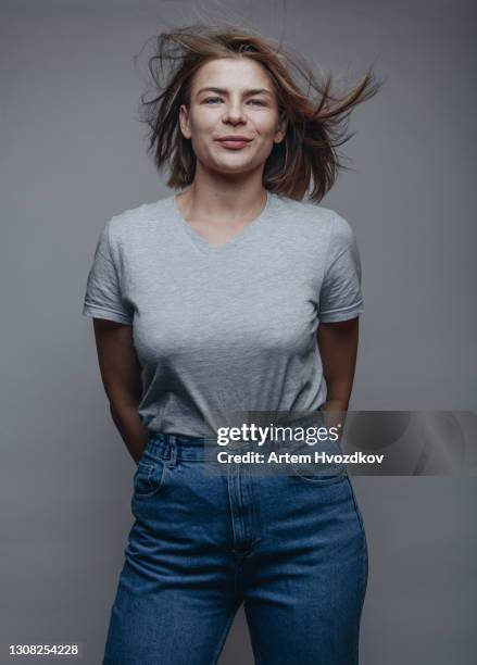 funny adult woman with flying hair in studio - one grey hair stock pictures, royalty-free photos & images