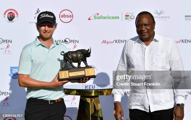 Justin Harding of South Africa and Uhuru Kenyatta, President of the Republic of Kenya pose with the trophy aduring Day Four of the Magical Kenya Open...