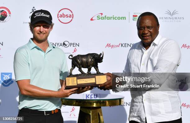 Justin Harding of South Africa and Uhuru Kenyatta, President of the Republic of Kenya pose with the trophy aduring Day Four of the Magical Kenya Open...