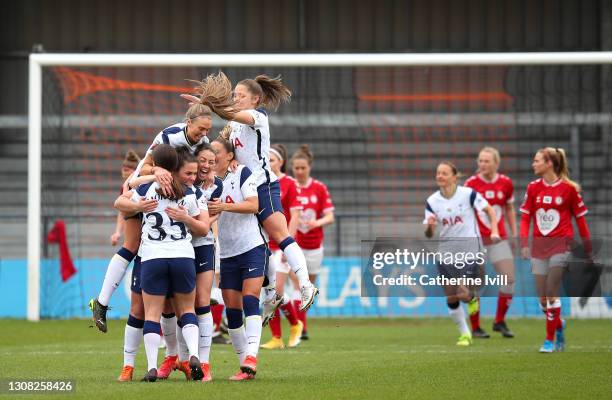 Siri Worm of Tottenham Hotspur celebrates with her team mates after scoring their side's first goal during the Barclays FA Women's Super League match...