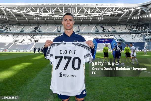 Cristiano Ronaldo of Juventus with a special shirt, created to celebrate 770 goals scored in his career prior to the Serie A match between Juventus...