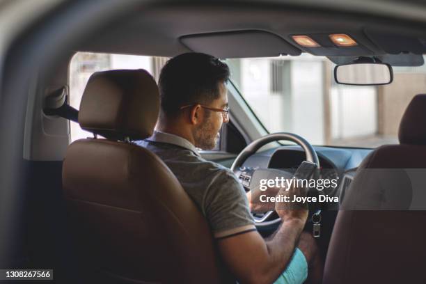 driver inside the car - taxi driver stock pictures, royalty-free photos & images
