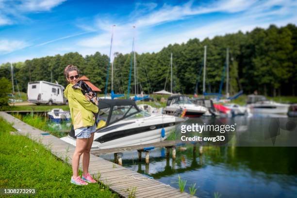 vacations with dog at the lake - sniardwy stock pictures, royalty-free photos & images