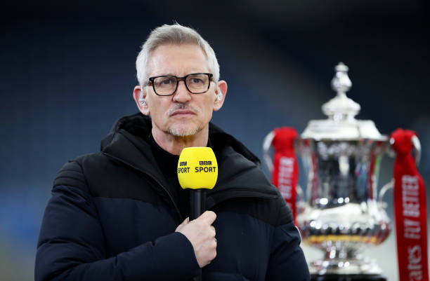 Gary Lineker, BBC Sport TV Pundit looks on whilst standing next to the FA Cup trophy prior to the Emirates FA Cup Quarter Final match between...