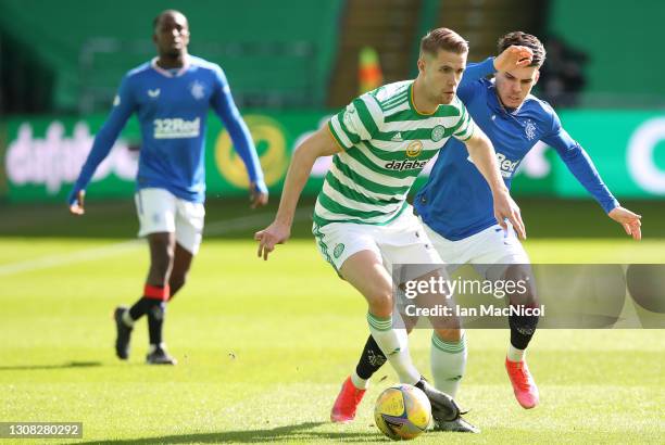 Kris Ajer of Celtic vies with Ianis Hagi of Rangers during the Ladbrokes Scottish Premiership match between Celtic and Rangers at Celtic Park on...