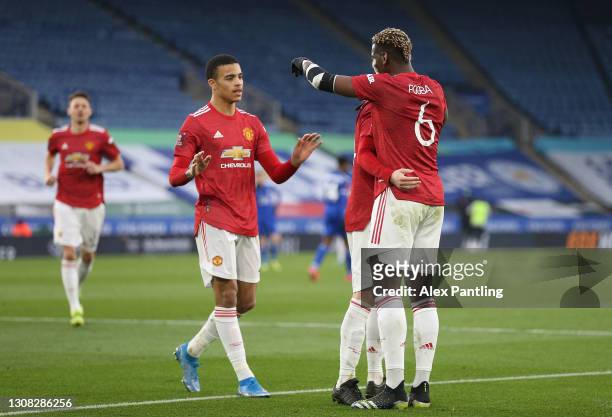 Mason Greenwood of Manchester United celebrates with Paul Pogba after scoring their side's first goal during the Emirates FA Cup Quarter Final match...