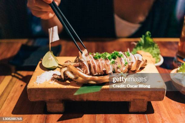 Eating Squid Photos and Premium High Res Pictures - Getty Images