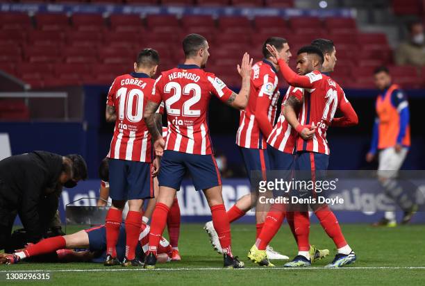 Luis Suarez of Atletico de Madrid celebrates with Angel Correa, Mario Hermoso and Thomas Lemar after scoring their side's first goal during the La...