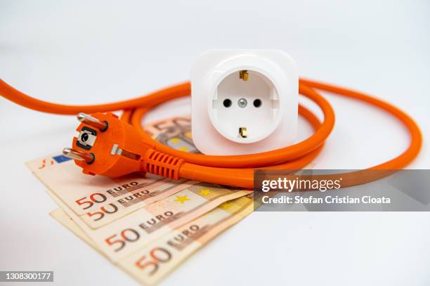 energy saving, plug, outlet and european notes - power cable stock pictures, royalty-free photos & images