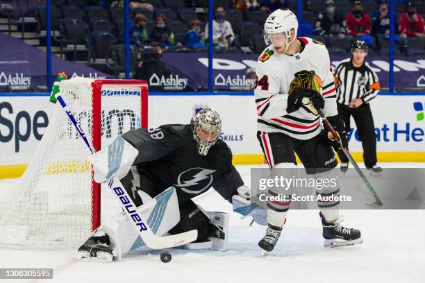 Goalie Andrei Vasilevskiy of the Tampa Bay Lightning tends net against Carl Soderberg of the Chicago Blackhawks during the second period at Amalie...