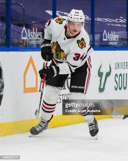 Carl Soderberg of the Chicago Blackhawks skates against the Tampa Bay Lightning during the first period at Amalie Arena on March 20, 2021 in Tampa,...