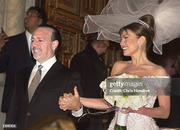 Producer Tommy Mattola with his new bride, Mexican actress and singer Thalia, just after their wedding ceremony December 2, 2000 in New York City.