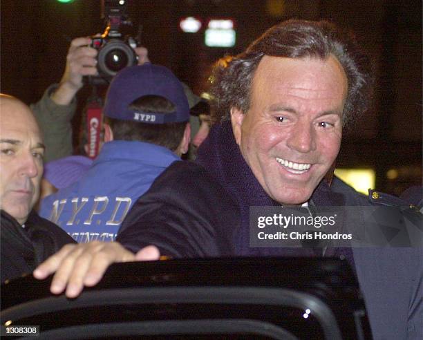 Singer Julio Iglesias leaves the wedding of Tommy Mottola and the singer Thalia, December 2, 2000 in New York City in this file photo. Iglesias''...