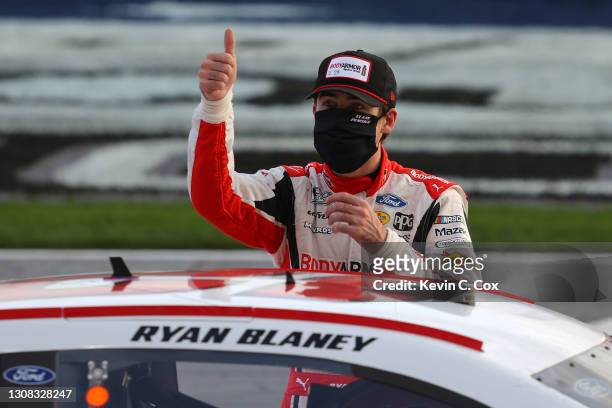 Ryan Blaney, driver of the BodyArmor Ford, celebrates after winning the NASCAR Cup Series Folds of Honor QuikTrip 500 at Atlanta Motor Speedway on...