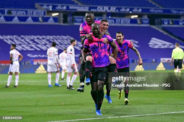 Danilo of Paris Saint-Germain is congratulated by teammates Moise Kean and Marco Verratti after scoring during the Ligue 1 match between Olympique...